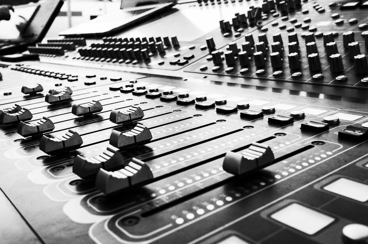 Faders on a sound desk.